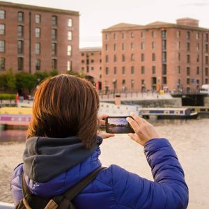 A Tourist Snaps a Picture of Liverpool