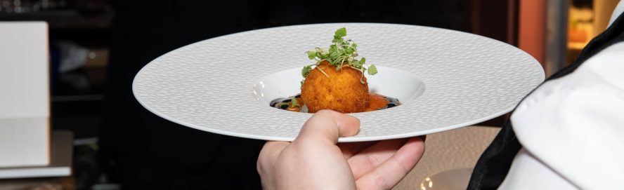 Waiter holding a plate of food at the Ninello's restaurant in Liverpool.
