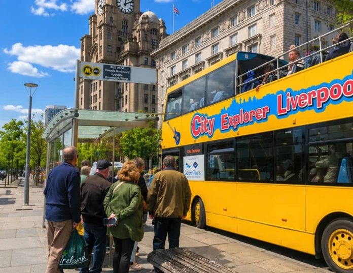Customers boarding the City Explorer bus at the Pier Head.