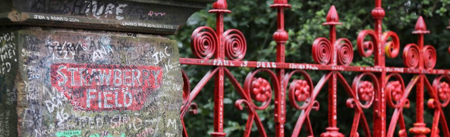 Outside the famous red gates of Strawberry Field in Liverpool.
